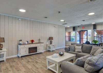 A well-appointed bedroom with a plush bed, a modern dresser, and a functional nightstand for personal items.